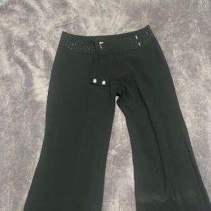 Black slacks with black shiny rhinestone detail along waist line